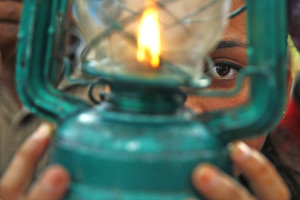 A Dalit woman holding a lantern in a protest rally demanding constitutional rights for  Dalits, in New Baneshwor, Kathmandu, on Saturday. Photo: THT